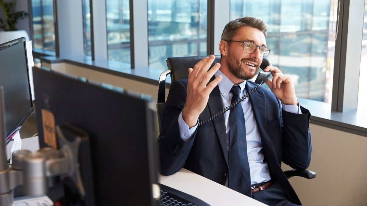businessman speaking on phone in office
